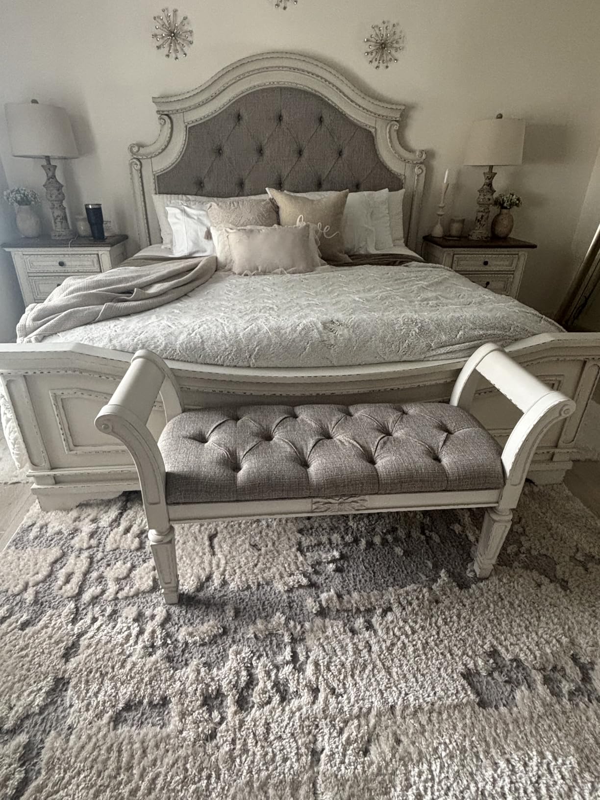Signature Design by Ashley Realyn Upholstered Accent Bench, Antique White | 100% polyester tufted cushion, Antiqued white finish, Wood frame, Scrolled arms, Entryway or bedroom use customer photo 1