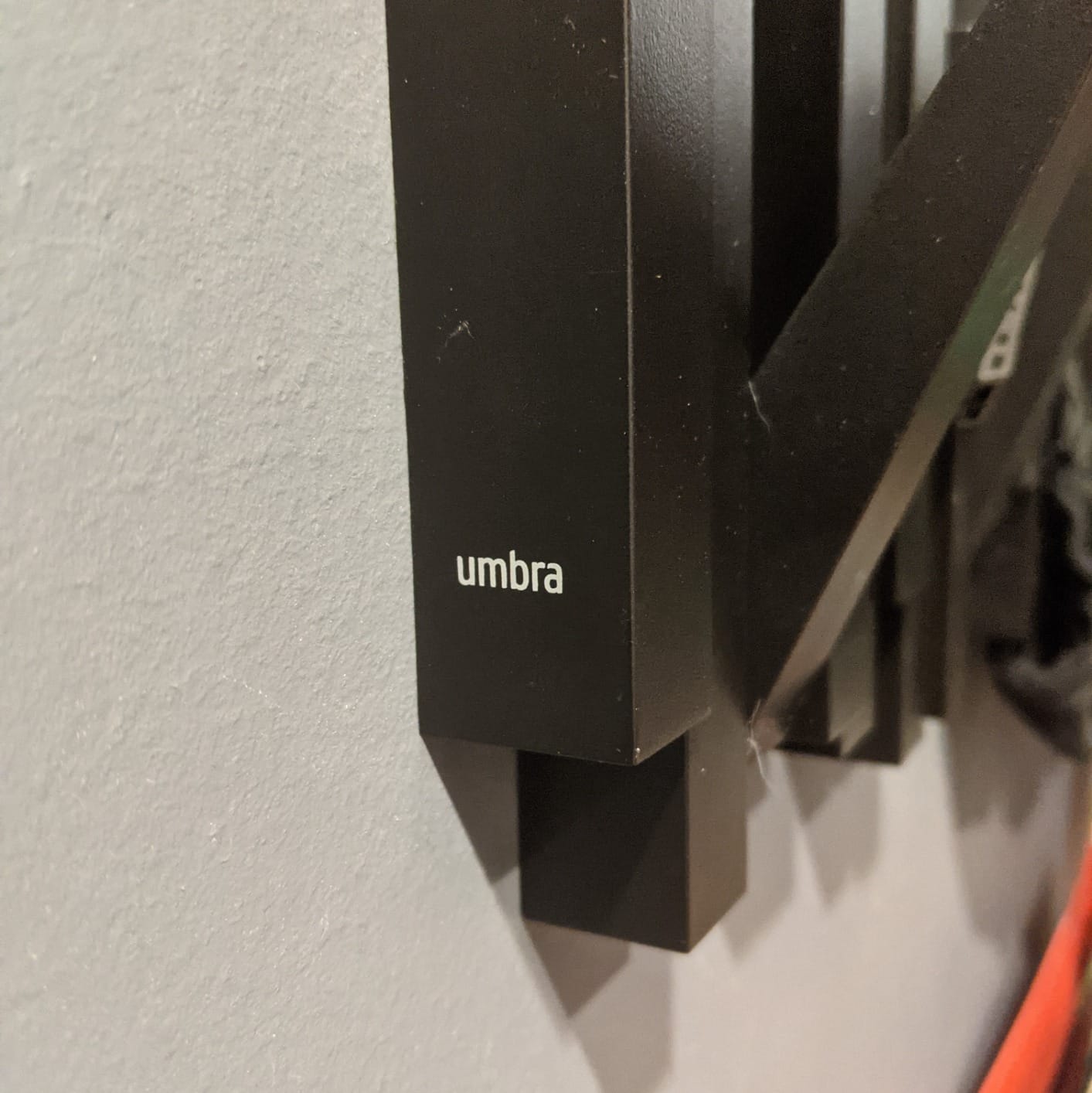 Umbra Sticks Wall Mount Coat Rack, 5 Hook Retractable Pegs, Black customer photo 1