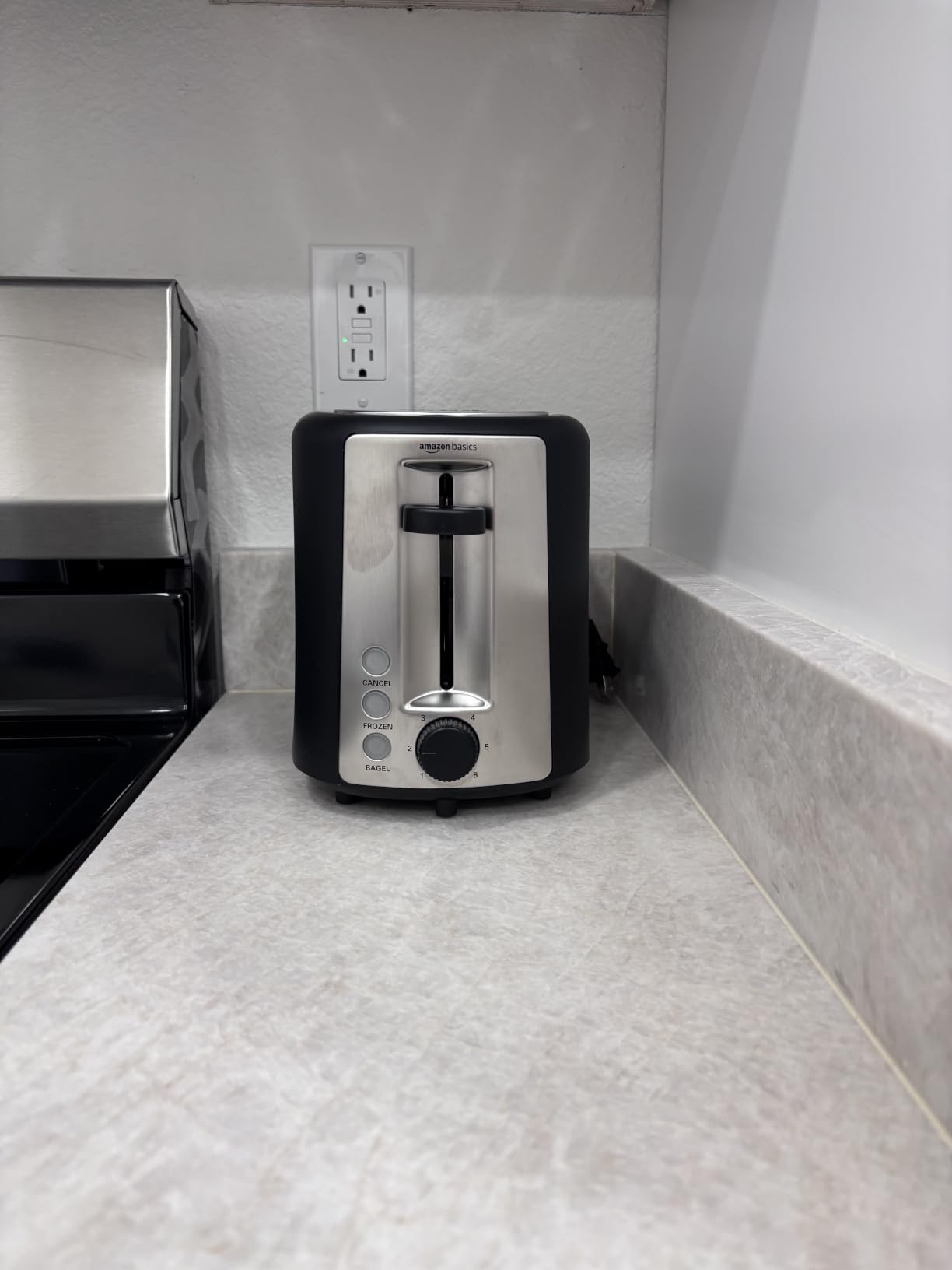 Amazon Basics 4 Slice Toaster, 7 Browning Settings, Extra Wide Slots for Bagels and Specialty Breads, Removable Crumb Tray, Cancel/Defrost/Bagel Buttons, 1500W, Black & Silver customer photo 2